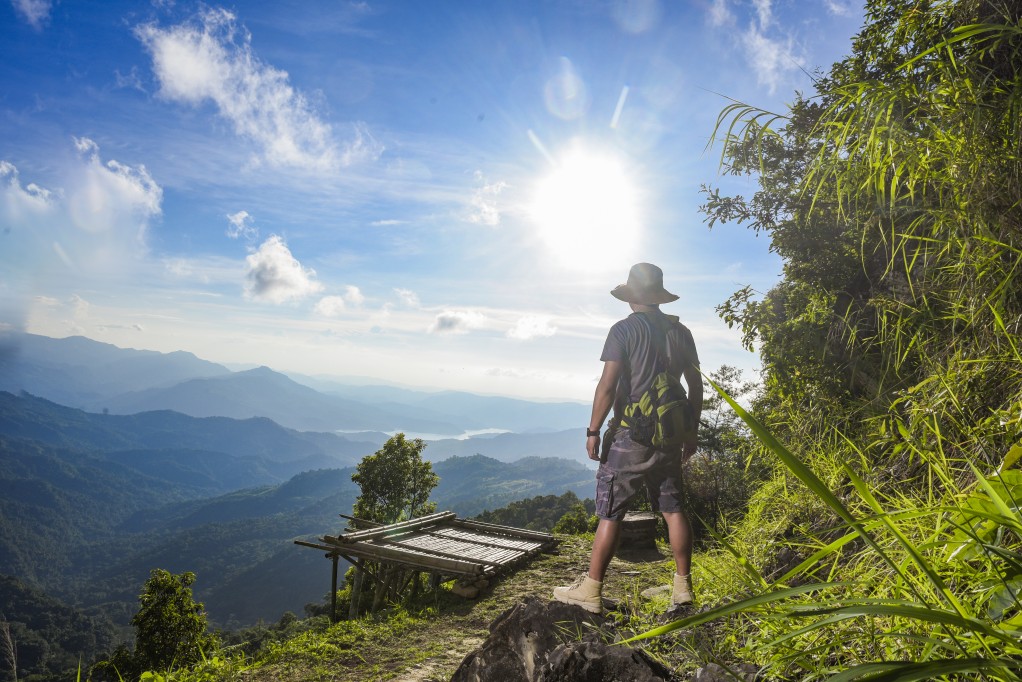 A trekker looking across the hills around Longkhum